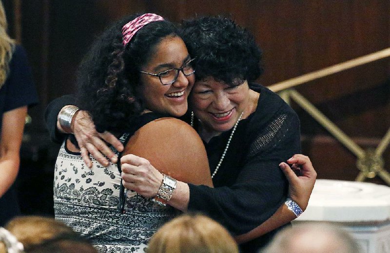 Jia Sharma, 11, receives a hug from Sonia Sotomayor before asking the U.S. Supreme Court justice a question Saturday at the Mississippi Book Festival in Jackson. Sotomayor was one of several authors featured at the event. 