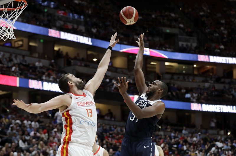 The Associated Press JUST WARMING UP: United States' Khris Middleton, right, shoots over Spain's Marc Gasol during the second half of an exhibition basketball game Friday in Anaheim, Calif.