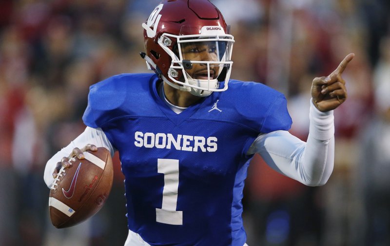 The Associated Press KEEPING IT REAL: Oklahoma quarterback Jalen Hurts gestures during the team's April 12 spring game in Norman, Okla. Hurts is cramming as he prepares for his only year with the Sooners. Before transferring from Alabama, he played in three national title games.