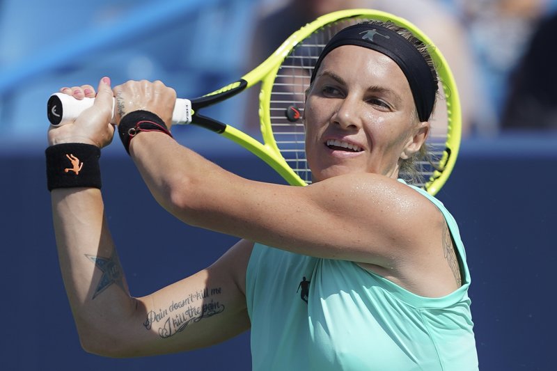 The Associated Press ANOTHER UPSET: Svetlana Kuznetsova, of Russia, returns to Ashleigh Barty, of Australia, during the Western &amp; Southern Open Saturday in Mason, Ohio. Kuznetsova won in straight sets, 6-2, 6-4, to add to a week of upsets and injuries.