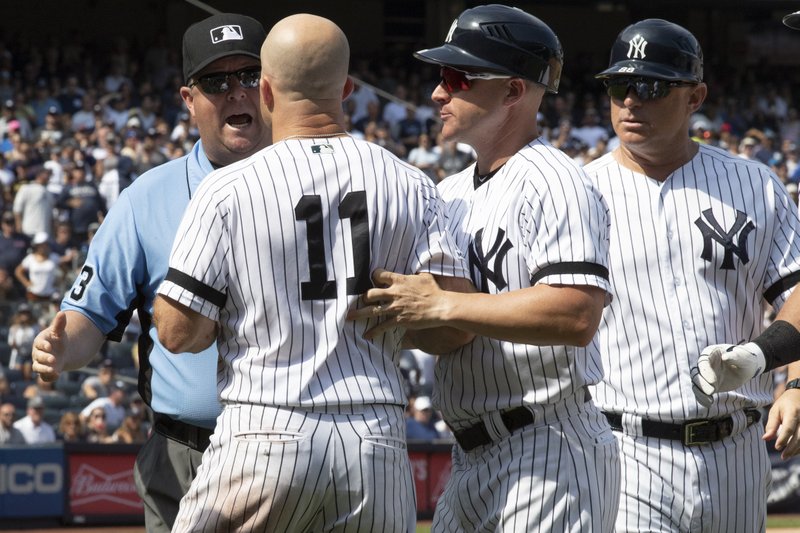 New York Yankees' Brett Gardner (11) argues with third base umpire Todd Tichenor after being ejected during the sixth inning of a baseball game against the Cleveland Indians, Saturday, Aug. 17, 2019, in New York. (AP Photo/Mary Altaffer)