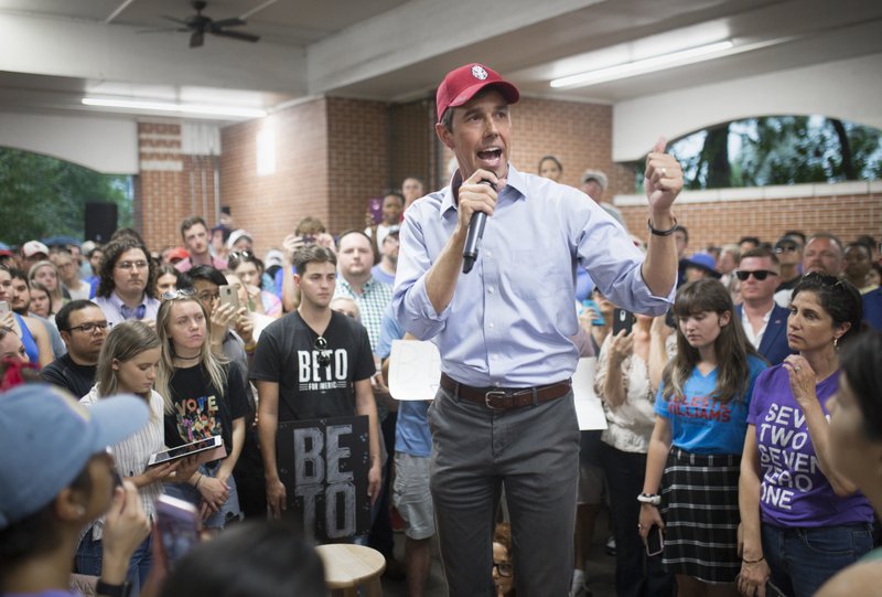 Democratic presidential candidate Beto O'Rourke speaks at a pavilion on the University of Arkansas campus today, Aug. 18. O'Rourke denounced gun violence in his home town of El Paso, Texas and thanked the crowd for attending despite a rainstorm.