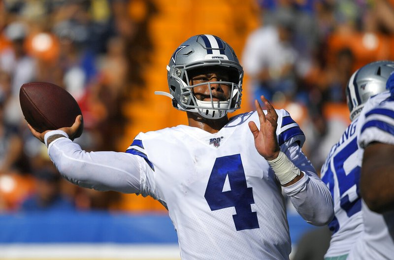 The Associated Press
LET IT FLY:
Dallas Cowboys quarterback Dak Prescott throws a pass during the first half of Saturday's preseason game against the Los Angeles Rams in Honolulu. 