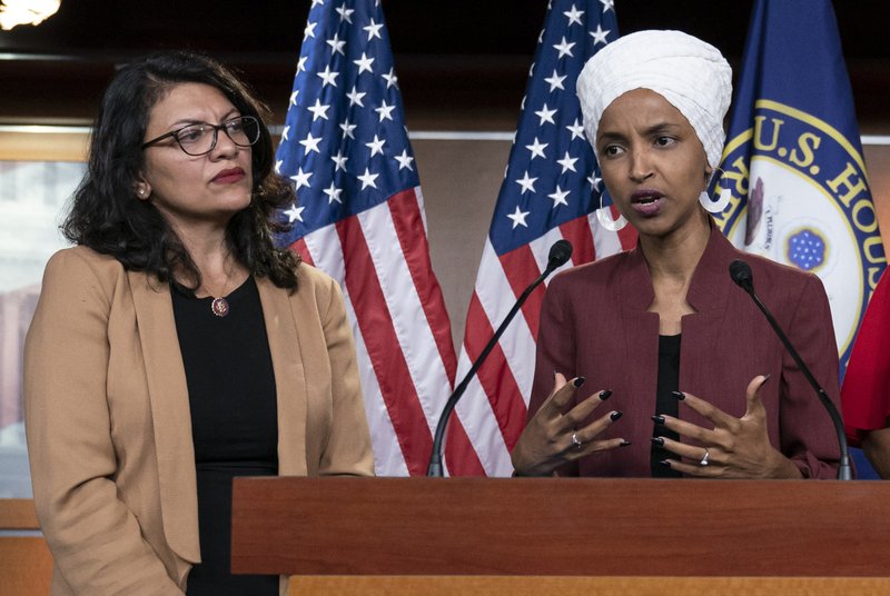 FILE - In this July 15, 2019, file photo, U.S. Rep. Ilhan Omar, D-Minn, right, speaks, as U.S. Rep. Rashida Tlaib, D-Mich. listens, during a news conference at the Capitol in Washington. In the eyes of critics, Benjamin Netanyahu’s decision to bar two Democratic congresswomen at the request of President Donald Trump is the latest reckless gamble by a prime minister willing to sacrifice Israel’s national interests for short-term gain. And yet the pursuit of such allegedly short-term gains has kept Netanyahu in power for more than a decade. (AP Photo/J. Scott Applewhite, File)

