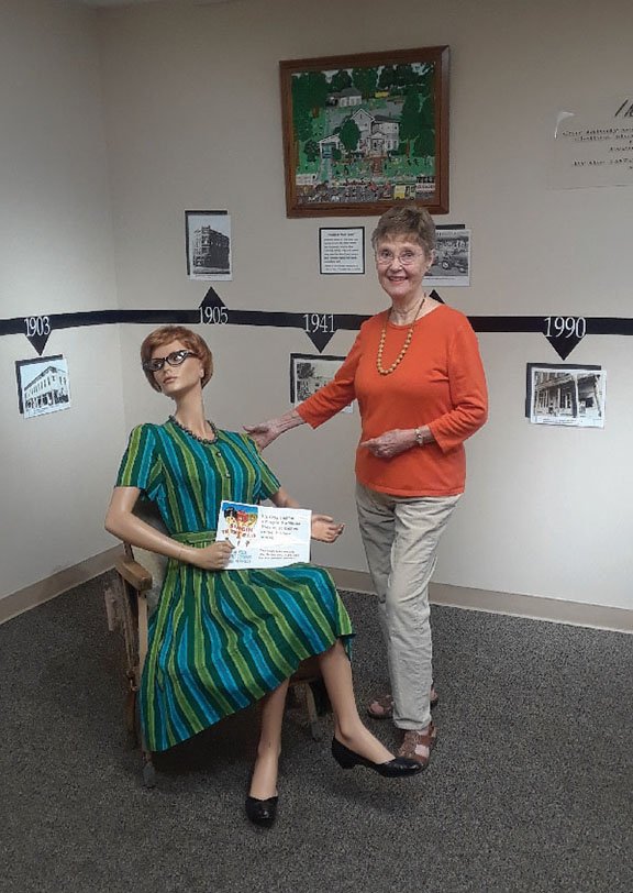 Twyla Wright, volunteer exhibit curator for the Old Independence Regional Museum in Batesville, stands next to a piece of the display Down on Main. The museum will host Main Street Memories on Saturday. Tickets are $20, and seating is limited. To get tickets, call the museum at (870) 793-2121.