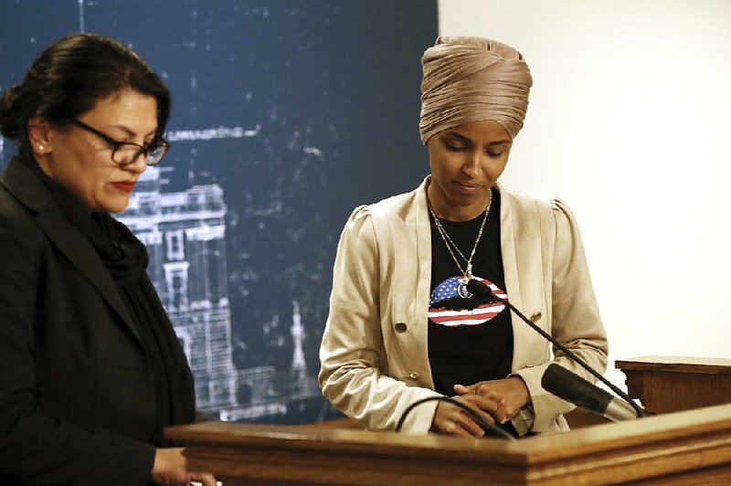 Reps. Rashida Tlaib (left) and Ilhan Omar, shown Monday at a news conference in St. Paul, Minn., were denied entry to Israel because of their support for a Palestinian-led boycott movement. 