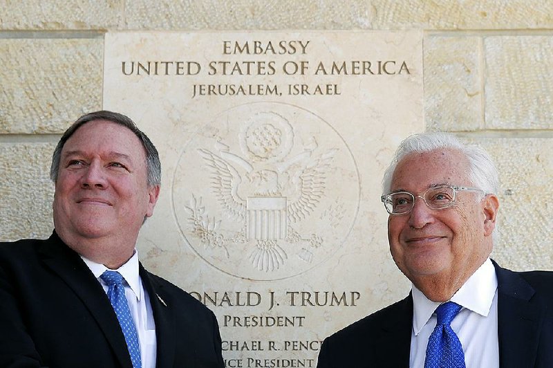 Secretary of State Mike Pompeo and U.S. Ambassador to Israel David Friedman stand next to the dedication plaque at the U.S. Embassy in Jerusalem in March. The 2017 decision to recognize Jerusalem as Israel’s capital led the Palestinians to cut ties with the U.S. 