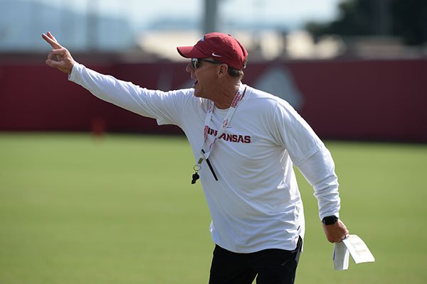Arkansas coach Chad Morris speaks to his team Tuesday, Aug. 20, 2019, during practice at the university's practice facility in Fayetteville. 