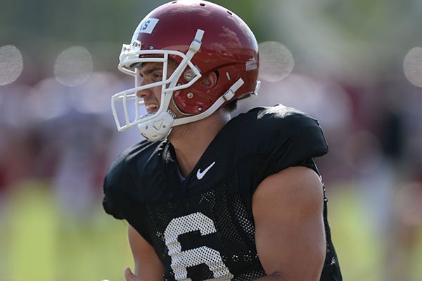 Arkansas quarterback Ben Hicks carries the ball Tuesday, Aug. 20, 2019, during practice at the university's practice facility in Fayetteville. 