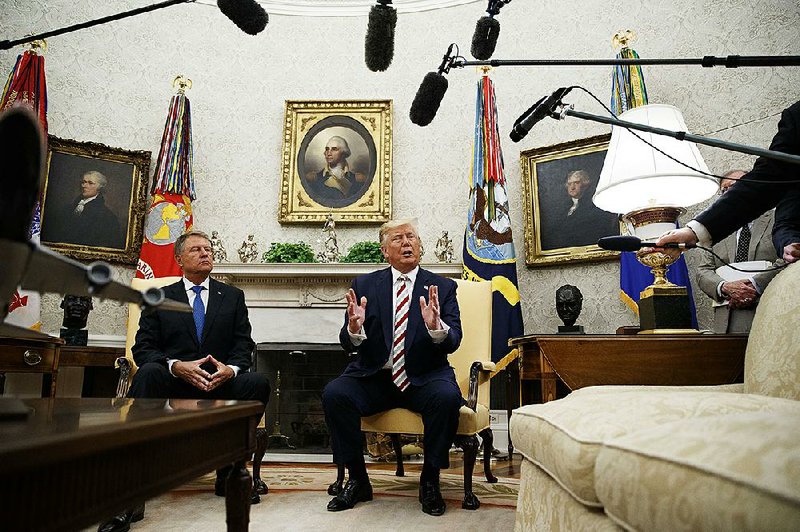During an Oval Office meeting Tuesday with Romanian President Klaus Iohannis, President Donald Trump said he was worried about a possible “slippery slope” on gun laws where “all of a sudden everything gets taken away.” 