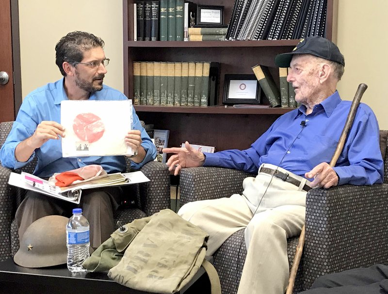 File photo/Herald-Leader Preston Jones interviewed Val Pariman for the last time in April for one of Jones' advanced history classes at John Brown University. The World War II veteran died on Aug. 11 at the age of 94.