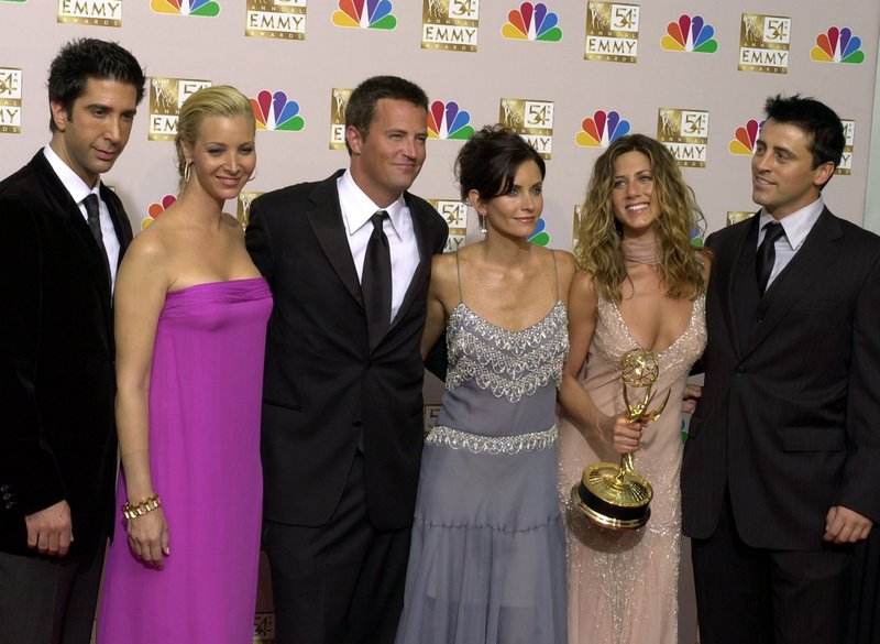 The Associated Press THE ONE WITH THE ANNIVERSARY: In this Sept. 22, 2002 file photo, the stars of "Friends," from left, David Schwimmer, Lisa Kudrow, Matthew Perry, Courteney Cox Arquette, Jennifer Aniston and Matt LeBlanc pose after the show won outstanding comedy series at the 54th Annual Primetime Emmy Awards, at the Shrine Auditorium in Los Angeles. If you're a "Friends" superfan, there are lots of ways to celebrate the show's 25th anniversary on Sept. 22. Warner Bros. has partnered with a range of companies to celebrate the quarter-century mark.