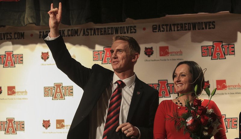 Wendy Anderson (right) appears with her husband Blake at a news conference announcing him as Arkansas State’s football coach Dec. 19, 2013. Wendy Anderson died Monday night after a lengthy battle with breast cancer.