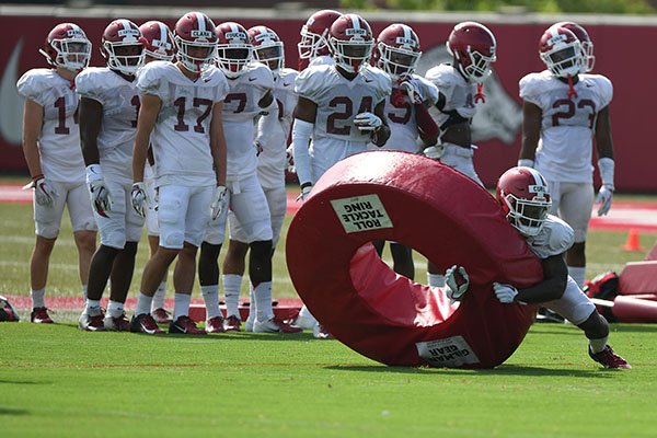 Arkansas safety Kamren Curl (2) runs through a drill Wednesday, Aug. 7, 2019, during practice at the university practice facility in Fayetteville. 