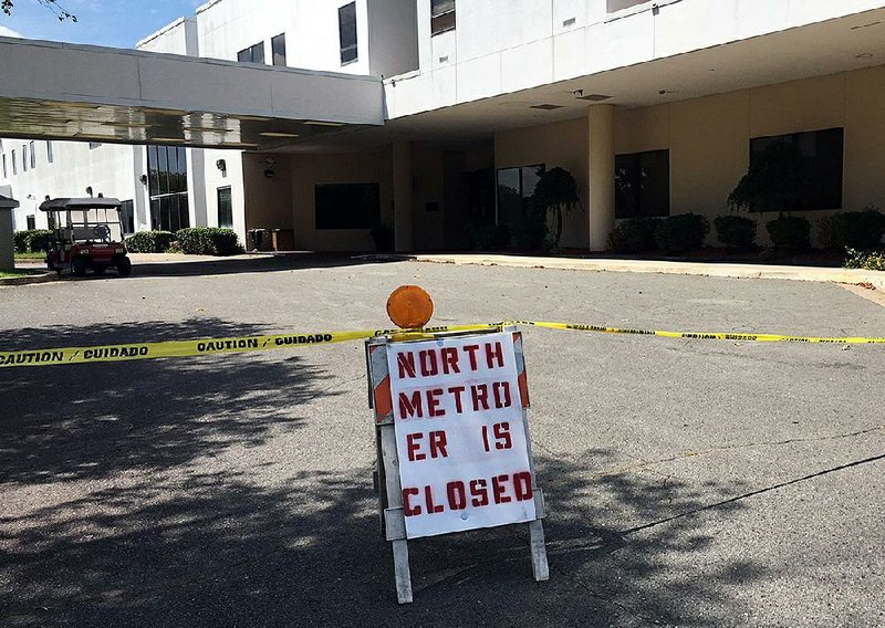 A sign warns patients away Wednesday at the North Metro Medical Center in Jacksonville after the facility closed its emergency room Tuesday night as it converts to geriatric psychiatric care. 