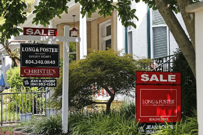 For sale signs beckon buyers along Park Avenue in Richmond, Va., last week. Sales of previously owned U.S. homes rose 2.5% in July, underscoring stability in the residential real estate market that’s gotten a boost from a drop in borrowing costs. 