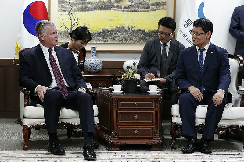 U.S. Special Representative for North Korea Stephen Biegun (left) and South Korean Unification Minister Kim Yeon Chul talk Wednesday at a government complex in downtown Seoul, South Korea. 