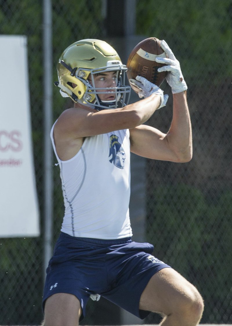 NWA Democrat-Gazette/BEN GOFF @NWABENGOFF Truitt Tollett, Shiloh Christian wide receiver, makes a touchdown catch in the game vs Choctaw (Okla.) Friday, July 12, 2019, during the Southwest Elite 7-on-7 tournament at Shiloh Christian's Champions Stadium in Springdale.