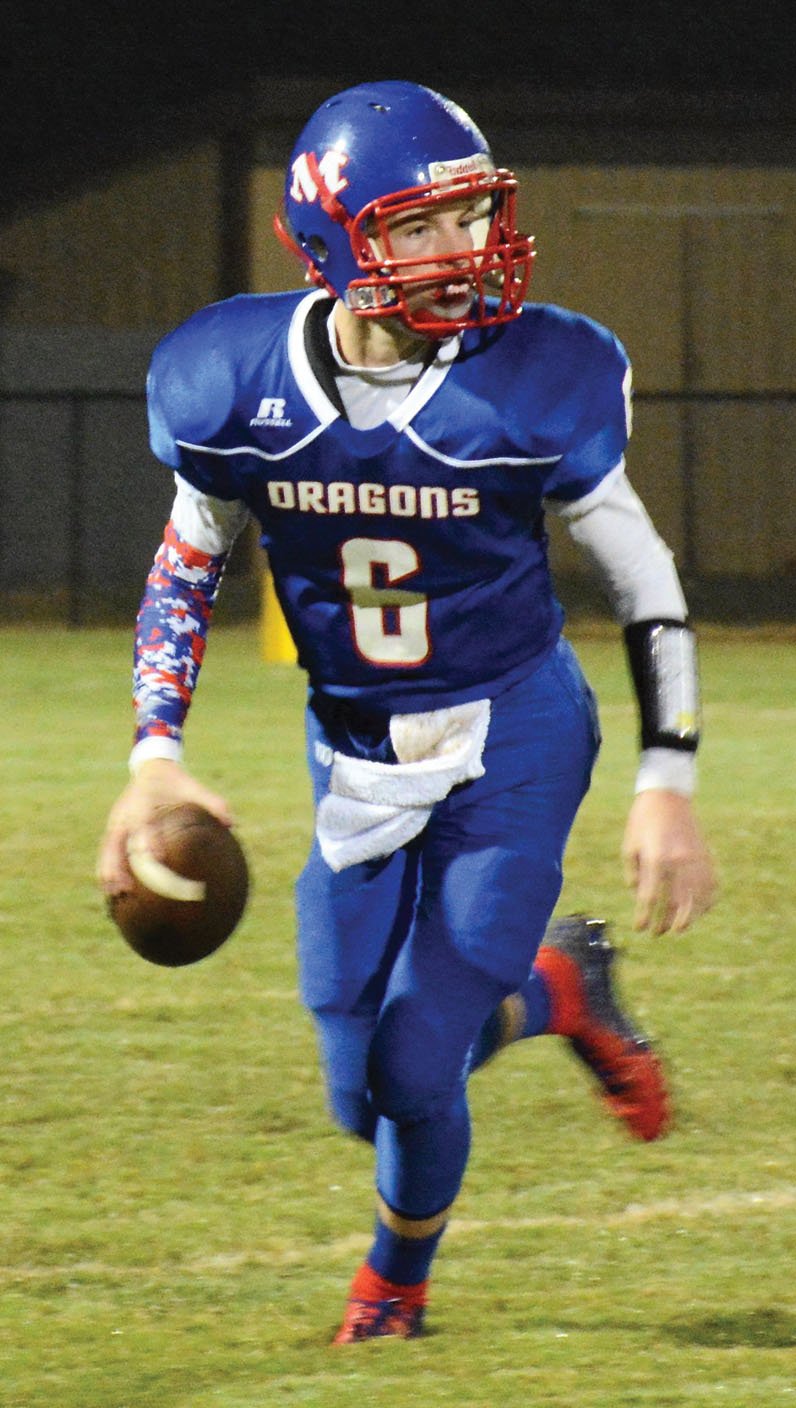 photo by TAMMY HOBSON  Mountianburg quarterback Ethan Gregory hopes to lead a potent Dragons' offense back to the playoffs this season.