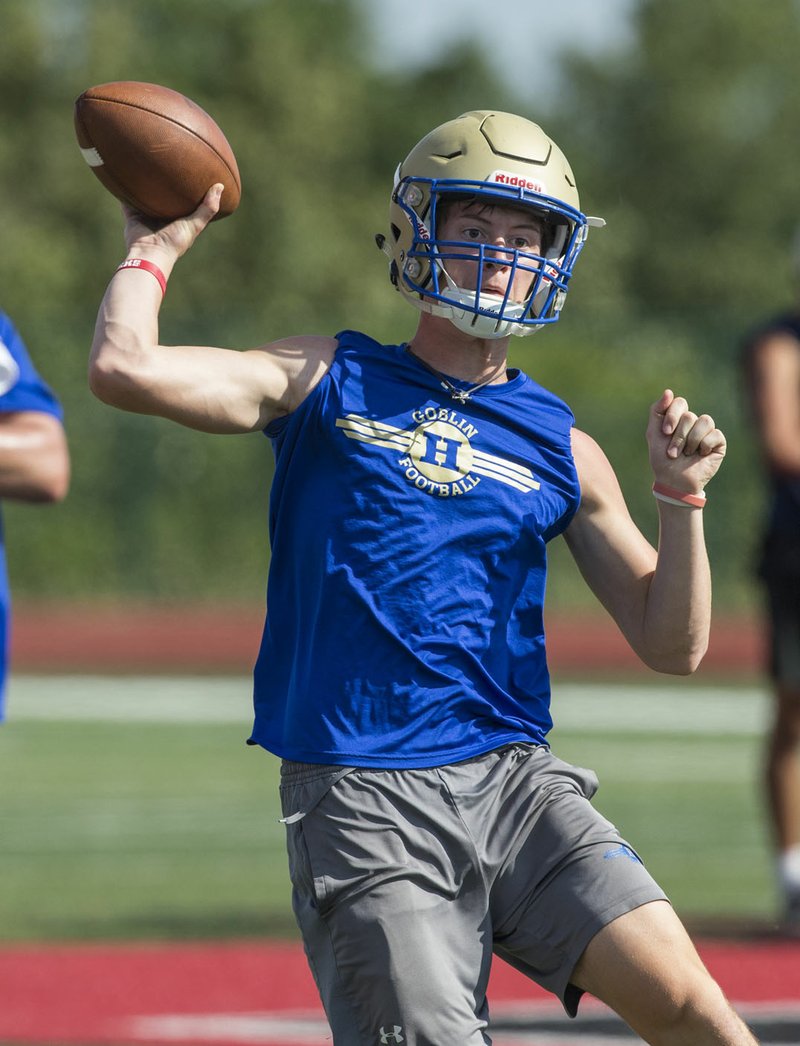 NWA Democrat-Gazette/BEN GOFF @NWABENGOFF Ben Johnson, Harrison quarterback, throws the ball in a game vs Rogers Thursday, July 11, 2019, during the Border Battle 7-on-7 Tournament, in partnership with the Pro Football Hall of Fame Scholastic 7v7 series, at Branson (Mo.) High School's Pirates Stadium.