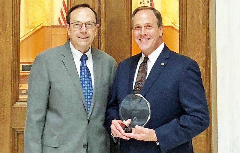 Submitted photo AWARD PRESENTATION: State Rep. Les Warren, R-District 25, of Hot Springs, right, receives the 2019 Statesman Award at the Capitol on Monday from Jerry Cox, president of the Family Council Action Committee.
