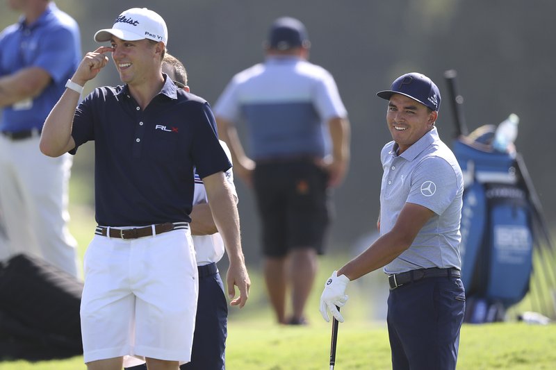 The Associated Press FRIENDLY COMPETITION: Justin Thomas, left, shares a laugh with Rickie Fowler as they prepare to play a practice round Wednesday for the Tour Championship in Atlanta.