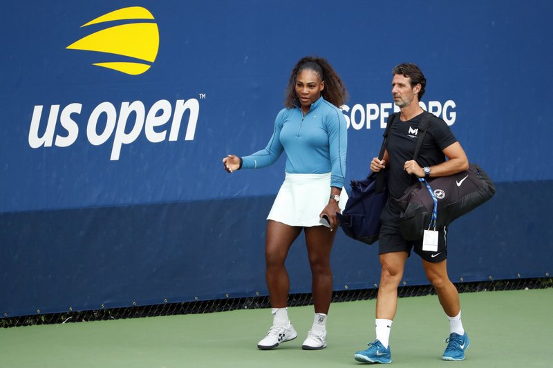 The Associated Press COACHING DILEMMAS: Serena Williams walks on a practice court on Aug. 31, 2018, with her coach Patrick Mouratoglou during the third round of the U.S. Open in New York. The tenor of the final between Williams and champion Naomi Osaka, whose terrific performance was largely ignored amid the chaos that enveloped Arthur Ashe Stadium, began to shift after chair umpire Carlos Ramos warned Williams for receiving coaching signals.