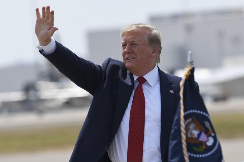 President Donald Trump waves to the crowd after arriving on Air Force One at Louisville International Airport in Louisville, Ky., Wednesday, Aug. 21, 2019. Trump is in town to speak at the American Veterans (AMVETS) 75th National Convention. (AP Photo/Susan Walsh)