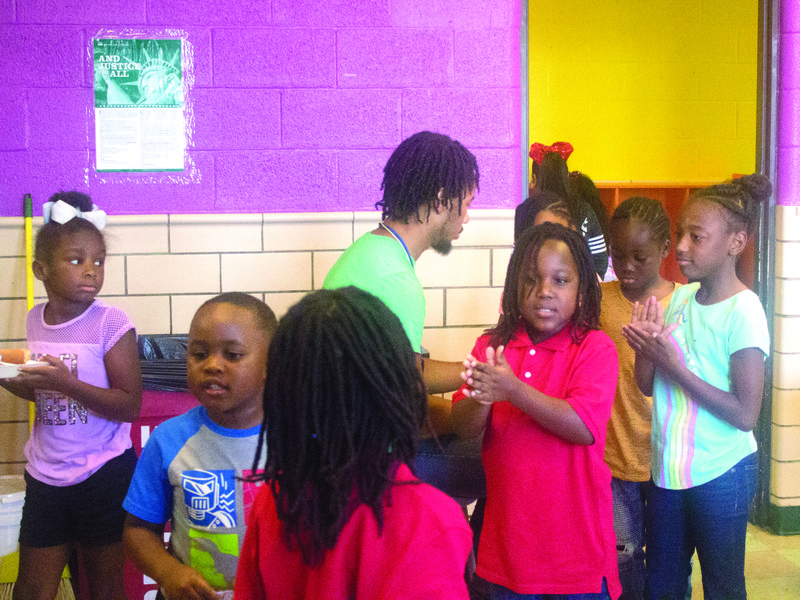 Snack time: El Dorado Boys & Girls Club members wash their hands before settling in for an afternoon meal that included fruit, a hotdog and green beans. The Boys & Girls Club started their fall programming on Monday. Caleb Slinkard / News-Times