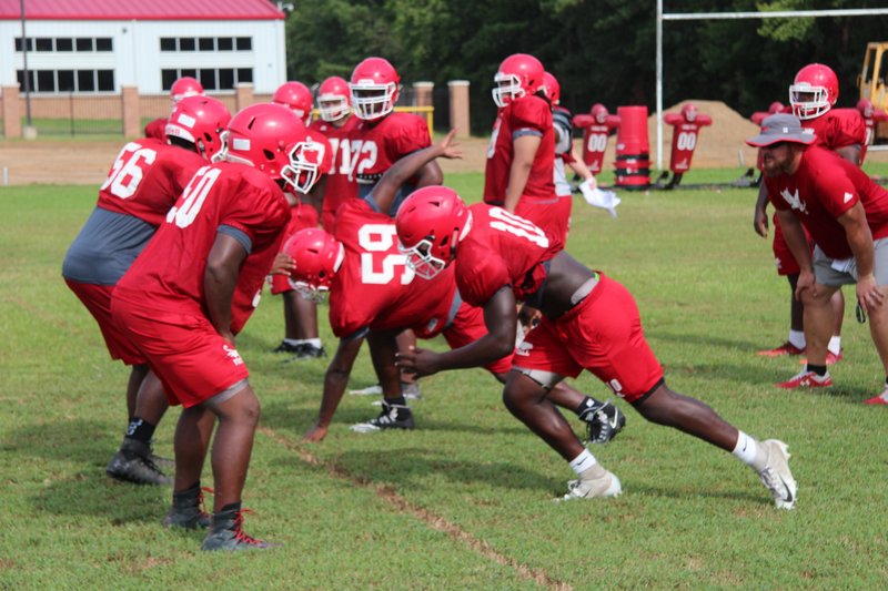 Magnolia linemen work on defensive techniques during fall practice. The Panthers will play Warren at SAU's Wilkins Stadium Tuesday at 5:30 p.m. as part of Hootens.com Kickoff Classic.  