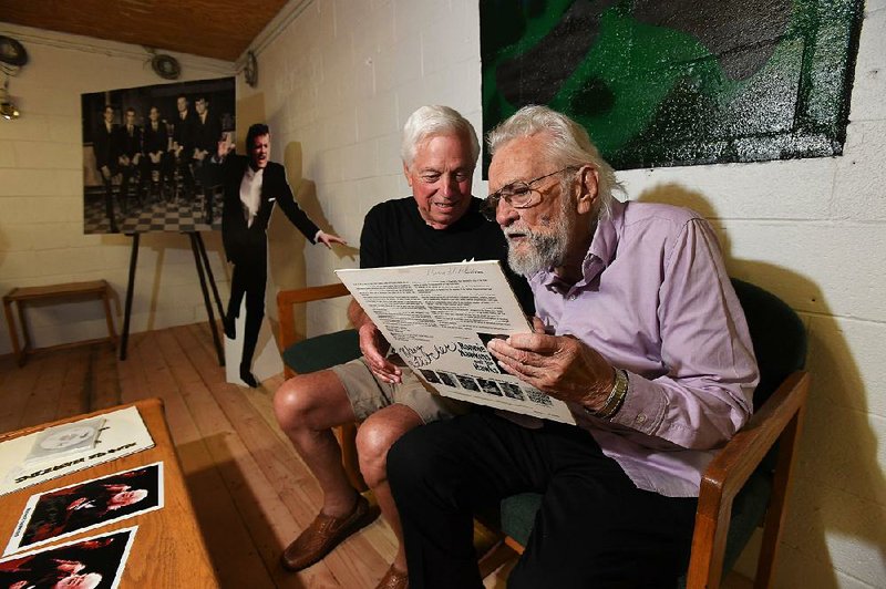 Ronnie Hawkins (right) visits with old friend Billy Lieblong during a reception Thursday at the storied Rockwood Club on the south side of Fayetteville. More photos at arkansasonline.com/823hawkins/ 