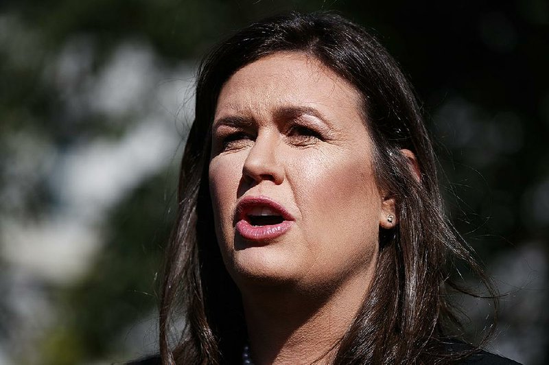 In this June 11, 2019 file photo, White House press secretary Sarah Sanders talks with reporters outside the White House in Washington. The former White House Press Secretary who once sparred with journalists, has decided to join them. 