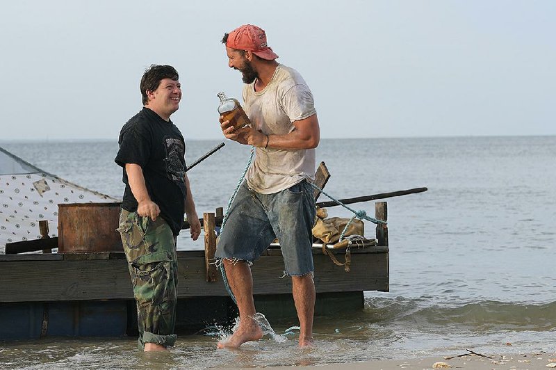 Zak (Zack Gottsagen) and Tyler (Shia LaBeouf) develop an easy rapport as they travel together in the feel-good sensation The Peanut Butter Falcon.