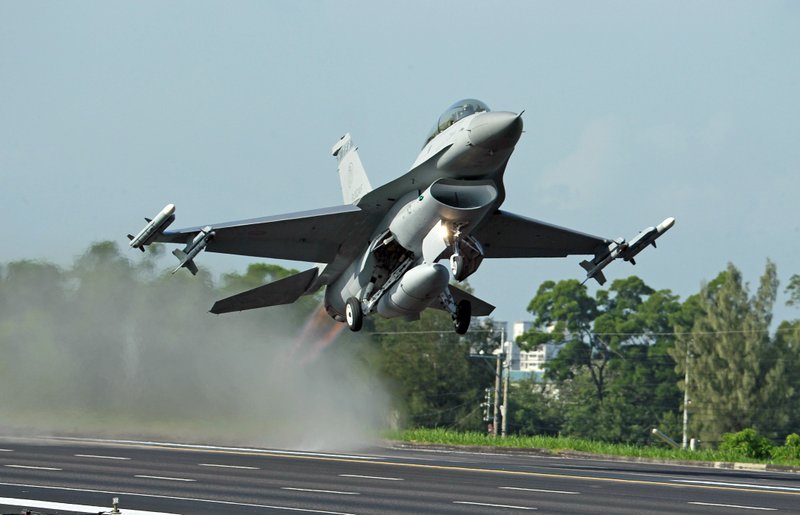 In this Sept. 16, 2014, file photo, a Taiwan Air Force F-16 fighter jet takes off from a closed section of highway during the annual Han Kuang military exercises in Chiayi, central Taiwan.  (AP Photo/Wally Santana, File)