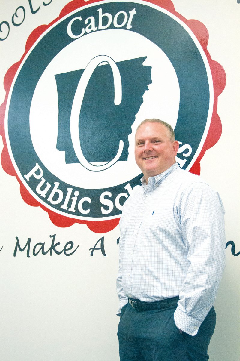 Michael Byrd, new assistant superintendent for the Cabot School District, stands in the board room at the central office. Byrd, who is originally from Texas, attended Harding University in Searcy and was hired as a science teacher at Cabot Junior High School South in December 1999. Cabot is the only district he’s worked in during his education career.