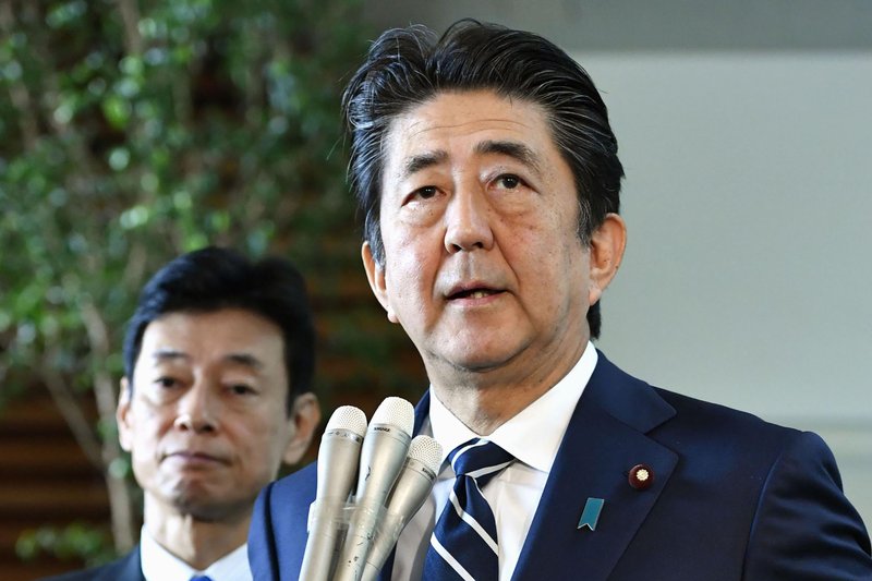 Japanese Prime Minister Shinzo Abe answers reporters' questions at his official residence in Tokyo Friday, Aug. 23, 2019. Abe said South Korea's decision to cancel a deal to share military intelligence is damaging mutual trust, and he vowed to work closely with the U.S. for regional peace. Abe also accused Seoul of not keeping past promises. The military agreement started in 2016. (Yoshitaka Sugawara/Kyodo News via AP)