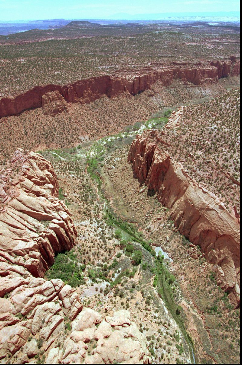 FILE - This May 30, 1997, file photo, shows the varied terrain of Grand Staircase-Escalante National Monument near Boulder, Utah. The U.S. government&#x2019;s final management plan for lands in and around the Utah national monument that President Donald Trump downsized doesn&#x2019;t include many new protections for the cliffs, canyons, waterfalls and arches found there, but it does include a few more safeguards than were in a proposal issued last year. The Bureau of Land Management&#x2019;s plan for the Grand Staircase-Escalante National Monument in southwestern Utah codifies that the lands cut out of the monument will be open to mineral extraction such as oil, gas and coal as expected, according to a plan summary the agency provided to The Associated Press. (AP Photo/Douglas C. Pizac, File)