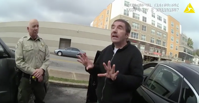 Robert Levy talks to police in this screenshot from a police video of Levy's arrest in March 2018.