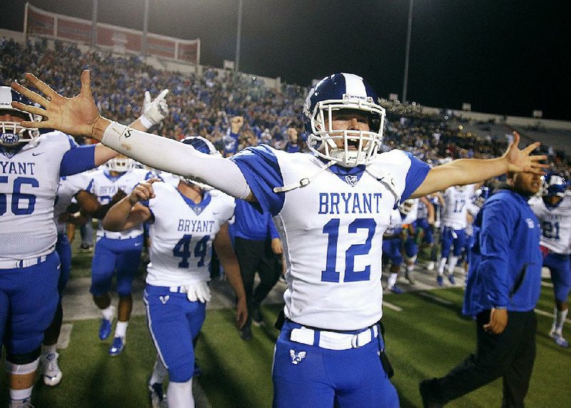 Bryant quarterback Austin Ledbetter celebrates after the Hornets’ 27-7 victory over North Little Rock in the Class 7A state championship game at War Memorial Stadium in Little Rock. Ledbetter returns for his junior season, and the Hornets open as the No. 1 team in the Arkansas Democrat-Gazette’s overall rankings. 