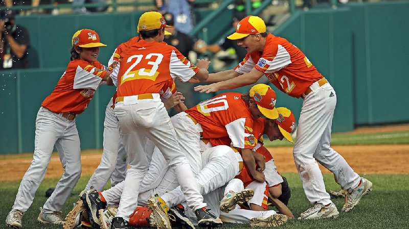 Members of the Louisiana team celebrate a 9-5 victory against Hawaii in the U.S. championship game of the Little League World Series tournament in South Williamsport, Pa., on Saturday. Louisiana will meet Curacao today for the championship.