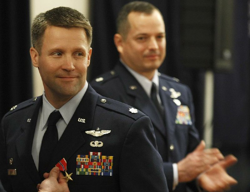 Brig. Gen. Daniel Tulley (left), who ended a stint as commander of the 41st Airlift Squadron at Little Rock Air Force Base in 2009, is now commander of the 379th Air Expeditionary Wing at Al Udeid air base in Qatar, the largest U.S. military base in the Middle East. 