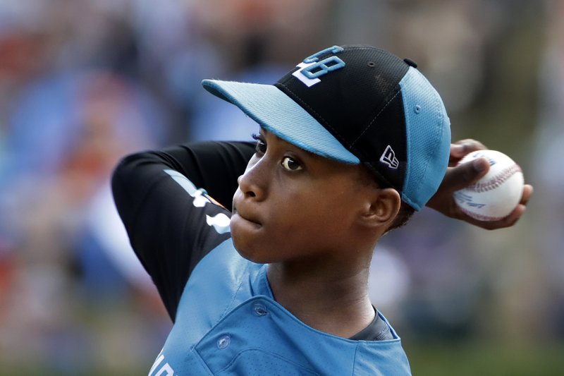 Curacao's Shendrion Martinus (6) delivers in the second inning of the International Championship baseball game against Japan at the Little League World Series tournament in South Williamsport, Pa., Saturday, Aug. 24, 2019. (AP Photo/Gene J. Puskar)
