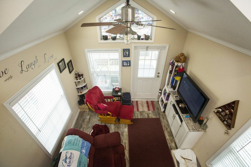 NWA Democrat-Gazette/BEN GOFF &#8226; @NWABENGOFF LJ Martin's tiny home has a vaulted ceiling and large windows in the living room in the Eagle Homes on Olive neighborhood in Rogers. "To live tiny is to live a minimalist lifestyle," Martin said.