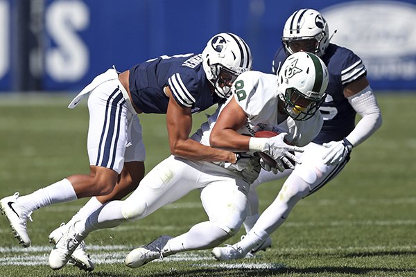 BYU's Troy Warner, left, tackles Portland State tight end Charlie Taumoepeau (89) in the second half during an NCAA college football game Saturday, Aug. 26, 2017, in Provo, Utah. (AP Photo/Rick Bowmer)

