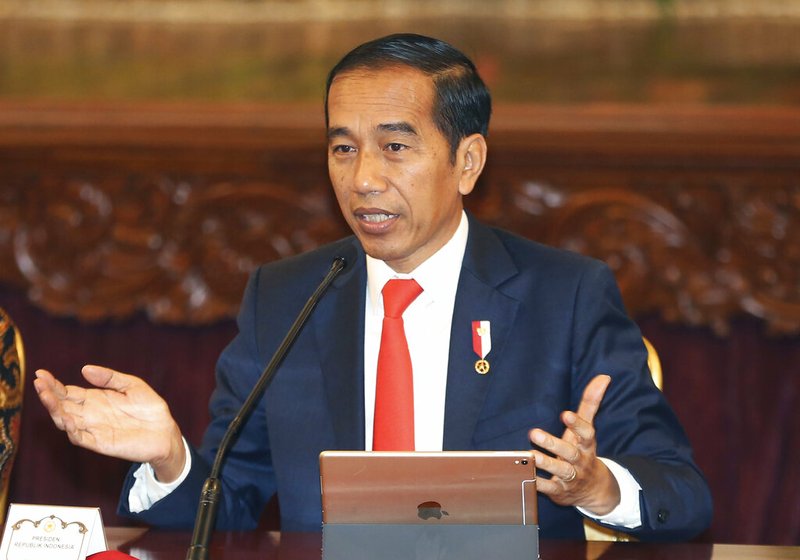 Indonesia President Joko Widodo gestures as he speaks during a press conference at the palace in Jakarta, Indonesia, Monday, Aug. 26, 2019. Indonesia's president has announced to relocate the country's capital from overcrowded, sinking and polluted Jakarta to East Kalimantan province. (AP Photo/Achmad Ibrahim)