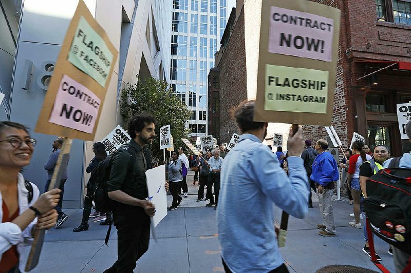 Tech workers in San Francisco march in July to support Facebook’s cafeteria workers who were rallying for a new contract with their company. 