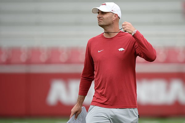 Arkansas assistant coach Barry Lunney Jr. speaks to his players Saturday, Aug. 24, 2019, during practice in Razorback Stadium in Fayetteville.