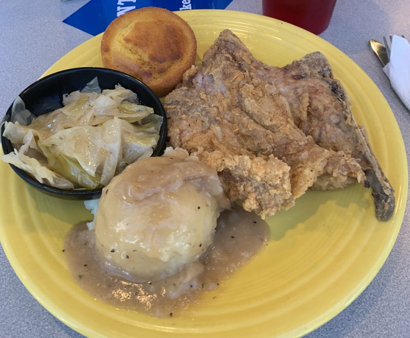 Flint's Just Like Mom's serves up hearty home-cooking in downtown Little Rock, including a fried pork steak, mashed potatoes and gravy with the popular fried cabbage, jalapeno cornbread and a drink. Arkansas Democrat-Gazette/Jerry McLeod