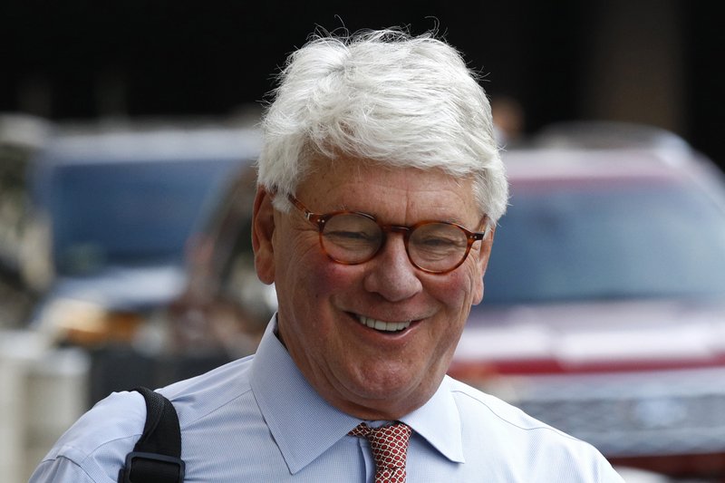 Greg Craig, former White House counsel to former President Barack Obama, walks into a federal courthouse for his trial, Thursday, Aug. 22, 2019, in Washington. (AP Photo/Patrick Semansky)