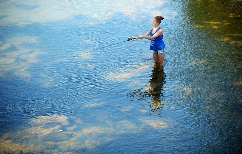 Virginia Pendleton, 16, a junior at the Agee-Lierly Life Preparation Services Center in Fayetteville, wades Thursday into the water while fishing during an outdoor education class outing in Spring Creek in Johnson. The class plans to return to the creek to collect invertebrates from the creek to study. The CARE Initiative's Las Faygas Texas Hold'em Tournament and Casino Night on Aug. 16 helped the group raise some $29,000. The benefit featured craps, roulette, Black Jack and Texas Hold'em tables, with winnings in the form of prizes. NWA Democrat-Gazette/ANDY SHUPE
